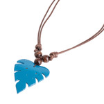Wood and calabash gourd pendant necklace, 'Jungle Blue' - Leafy Blue Calabash Gourd Pendant Necklace with Wood Beads