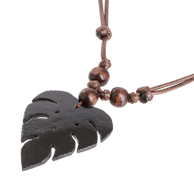Wood and calabash gourd pendant necklace, 'Jungle Night' - Leafy Black Calabash Gourd Pendant Necklace with Wood Beads