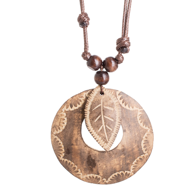 Wood and calabash gourd pendant necklace, 'Memories from the Forest' - Leafy Round Calabash Gourd Pendant Necklace with Wood Beads