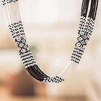 Long beaded torsade necklace, 'Black and White Harmony' - Handcrafted Black and White Glass Beaded Torsade Necklace