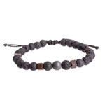 Men's hematite and volcanic stone beaded bracelet, 'Inner Protector' - Men's Volcanic Stone Beaded Bracelet with Hematite Jewel