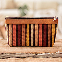Leather-accented cotton cosmetic bag, 'Fertile Land' - Striped Hand-Woven Cotton Cosmetic Bag with Leather Trim