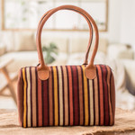 Leather-accented cotton handbag, 'Striped Realm' - Leather-Accented Warm-Toned Striped Cotton Handbag