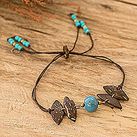 Coconut shell and ceramic pendant bracelet, 'Natural Vibrancy' - Handmade Coconut Shell Pendant Bracelet with Ceramic Bead