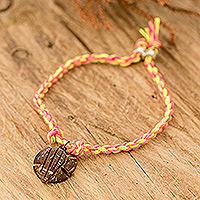 Coconut shell braided pendant bracelet, 'Lovely Turtle' - Colorful Braided Bracelet with Coconut Shell Turtle Pendant