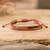 Beaded wristband bracelet, 'Charming Brown' - Handmade Glass Beaded Wristband Bracelet with Burgundy Cord