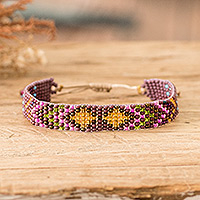 Beaded wristband bracelet, 'Majestic Atitlan' - Geometric Purple and Golden Glass Beaded Wristband Bracelet