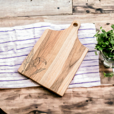 Wood cutting board, 'Toucan's Delicacies' - Handcrafted Laurel Wood Cutting Board with Toucan Engraving