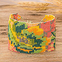 Glass beaded wristband bracelet, 'Tropical Winds' - Adjustable Orange and Green Glass Beaded Wristband Bracelet