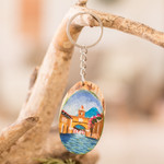 Wood keychain, 'Antigua's Charm' - Hand-Carved Pinewood Keychain with Antigua's Arch Painting