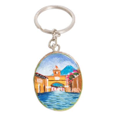 Wood keychain, 'Antigua's Charm' - Hand-Carved Pinewood Keychain with Antigua's Arch Painting