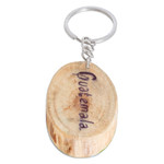 Wood keychain, 'Antigua's Charm' - Hand-Carved Pinewood Keychain with Antigua's Arch Painting