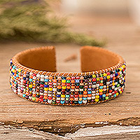 Leather-accented glass beaded cuff bracelet, 'Rainbow Harmony' - Rainbow-Toned Glass Beaded Cuff Bracelet with Leather Accent