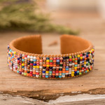 Leather-accented glass beaded cuff bracelet, 'Rainbow Harmony' - Rainbow-Toned Glass Beaded Cuff Bracelet with Leather Accent