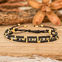 Glass beaded bracelet, 'Luxurious Inspiration' - Adjustable Black and Golden Bracelet with Morse Code Message
