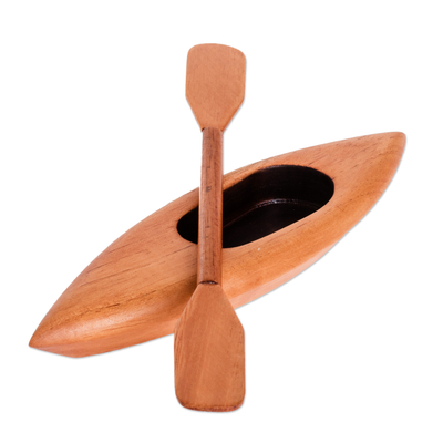 Todo de madera - Canoa marrón tallada a mano con remo