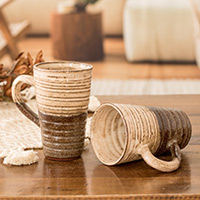 Ceramic mugs, 'Authentic Flavor' (pair) - Traditionally Crafted Ceramic Mugs in Ivory and Brown (Pair)