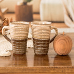 Ceramic mugs, 'Authentic Flavor' (pair) - Traditionally Crafted Ceramic Mugs in Ivory and Brown (Pair)