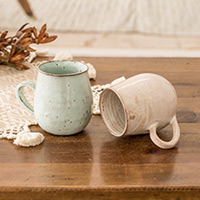 Ceramic mugs, 'Serene Delights' (set of 2) - Set of 2 Handcrafted Pale Green and Ivory Ceramic Mugs