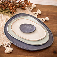 Ceramic serving plates, 'Versatility and Style' (set of 4) - Set of 4 Handcrafted Blue and Ivory Ceramic Serving Plates