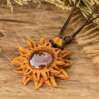 Resin and glass pendant necklace, 'Solar Luster' - Handcrafted Adjustable Resin Pendant Necklace with Sun Motif