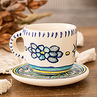 Ceramic cup and saucer, 'Bermuda' - Hand-Painted Ceramic Cup and Saucer with Floral Wavy Motifs