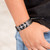 Men's leather pendant bracelet, 'High Seas Anchor' - Men's Black Leather Stainless Steel Anchor Pendant Bracelet