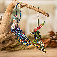 Glass beaded ornaments, 'Peacock Splendor' (pair) - Pair of Glass Beaded Peacock-Themed Ornaments from Guatemala