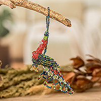 Glass beaded ornament, 'Rainbow Peacock Splendor' - Multicolored Glass Beaded Peacock Ornament from Guatemala