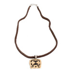 Coconut shell and lava stone pendant necklace, 'Spiritual Liberation' - Coconut Shell and Lava Stone Tijax Sign Pendant Necklace