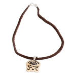 Coconut shell and lava stone pendant necklace, 'Dream Seeker' - Coconut Shell and Lava Stone K'at Sign Pendant Necklace