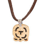 Coconut shell and lava stone pendant necklace, 'Strength and Renewal' - Coconut Shell and Lava Stone Iq' Sign Pendant Necklace