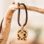 Coconut shell and lava stone pendant necklace, 'Spiritual Union' - Coconut Shell and Lava Stone Kawoq Sign Pendant Necklace
