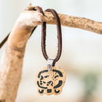 Coconut shell and lava stone pendant necklace, 'Free Path' - Coconut Shell and Lava Stone Maya E Sign Pendant Necklace