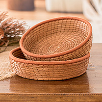 Pine needle baskets, 'Ginger Lands' (set of 2) - Set of 2 Woven Spiral Pine Needle Baskets with Ginger Trim