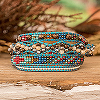 Crystal and glass beaded wrap bracelet, 'Encircling Flair' - Handwoven Beaded Blue-Hued Wrap Bracelet with Pewter Button