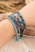 Crystal and glass beaded wrap bracelet, 'Encircling Flair' - Handwoven Beaded Blue-Hued Wrap Bracelet with Pewter Button