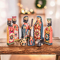 Wood nativity scene, 'The Promised Arrival' (8 pieces) - Hand-Painted Folk Art-Themed 8-Piece Pinewood Nativity Scene