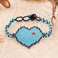 Beaded pendant bracelet, 'Blue Love Inspiration' - Beaded Pendant Bracelet in Light Blue with Heart Theme