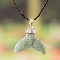 Jade pendant necklace, 'Blissful Fins' - Handcrafted Whale-Themed Light Green Jade Pendant Necklace