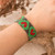 Beaded wristband bracelet, 'Green Queen of Hearts' - Adjustable Grey Red Green Beaded Bracelet with Heart Theme