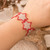 Beaded wristband bracelet, 'Silver Starlight' - Red and Silver-Hued Star Beaded Bracelet from Guatemala