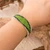 Beaded wristband bracelet, 'Evergreen Harmony' - Adjustable Glass Beaded Wristband Bracelet in Green Hues