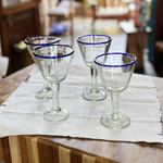Handblown recycled glass wine glasses, 'Waves of Glee' (set of 4) - Set of 4 Eco-Friendly Handblown Wine Glasses with Blue Rim