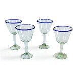 Handblown recycled glass wine glasses, 'Waves of Glee' (set of 4) - Set of 4 Eco-Friendly Handblown Wine Glasses with Blue Rim