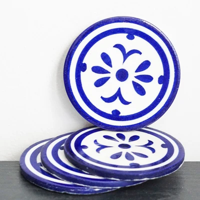Ceramic coasters, 'Fleur' (set of 4) - Set of 4 Blue Ceramic Pottery Coasters Made in India