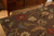 Handgetufteter Teppich aus Wollmischung in Braun/Mehrbereich mit Blumenmuster - Handgetufteter Teppich aus Wollmischung in Braun/Mehrbereich mit Blumenmuster