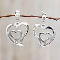 Sterling silver dangle earrings, 'Your Heart in Mine' - Handmade Silver Heart Earrings