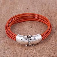 Leather wristband bracelet, 'Orange Passion' - Handcrafted Orange Leather Wristband Bracelet from Peru