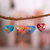 Ceramic ornaments, 'Love Quartet' (set of 4) - Hand Painted Ceramic Heart-Shaped Ornaments (Set of 4) thumbail
